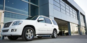A technician performs a convenient mobile vehicle inspection on an SUV.
